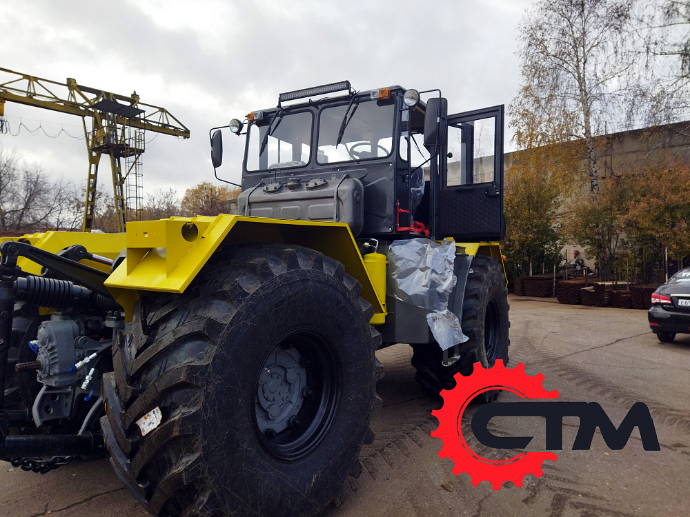 Трактор Кировец К-700 с фрезероторным снегоочистителем ФРС-3.2